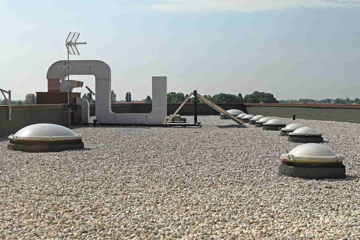 Gravel on a roof displaying a completed built up roof